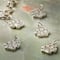 12 Packs: 12 ct. (144 total) Charmalong™ Rhodium Paw Charms by Bead Landing™
